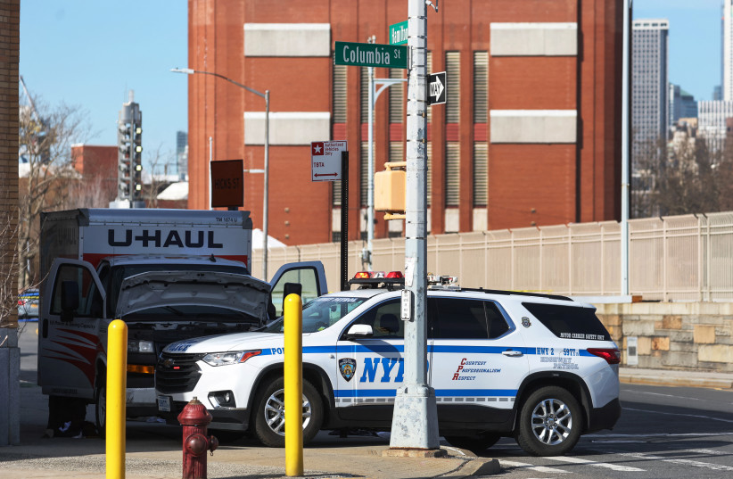  A New York Police Department vehicle blocks a U-Haul rental vehicle, where according to media reports, a man struck multiple people and the NYPD took the driver into custody, near the Battery tunnel in the Brooklyn borough of New York City, US, February 13, 2023.  (credit: REUTERS/SHANNON STAPLETON)