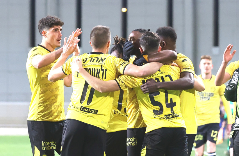 MACCABI NETANYA players celebrate after their 2-1 home victory over Maccabi Tel Aviv on Tuesday night in Israel Premier League action. (photo credit: BERNEY ARDOV)