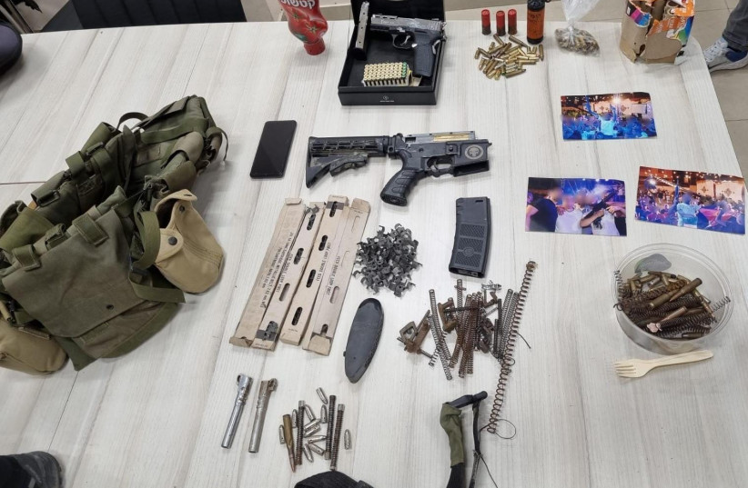 Stolen weaponry, ammunition and gun parts seized by Israel Police during a February 16, 2023 raid of a Beit Hanina home (credit: ISRAEL POLICE)