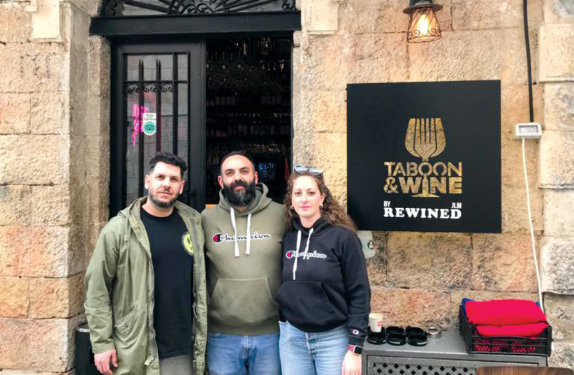  MIRAN KRIKORIAN in front of his Old City eatery, with his wife and brother. (credit: Courtesy Miran Krikorian)