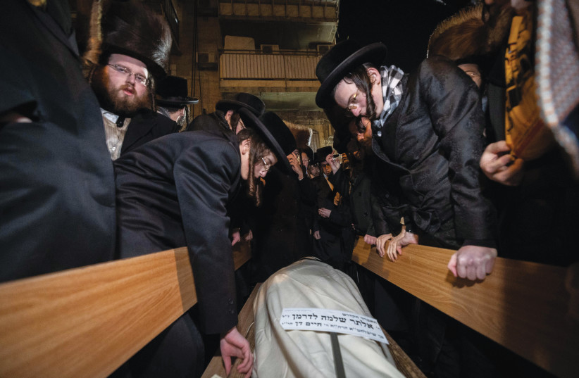  AT THE funeral of Alter Shlomo Lederman, 20, a newlywed yeshiva student murdered in the car ramming near Jerusalem’s Ramot junction, Feb. 11.  (photo credit: YONATAN SINDEL/FLASH90)