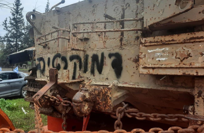 The word 'democracy' painted on the stolen tank. (credit: ISRAEL POLICE SPOKESPERSON'S UNIT)