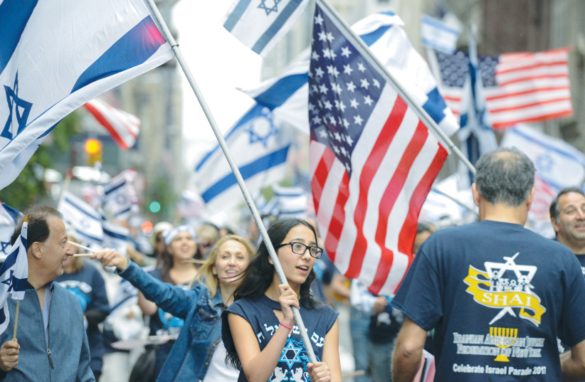 THE ANNUAL Celebrate Israel parade takes place along Fifth Avenue in New York City, in 2017. As much merit as there is in the argument that Zionists must live in Israel, it isn’t necessarily correct, says the writer. (photo credit: STEPHANIE KEITH/REUTERS)