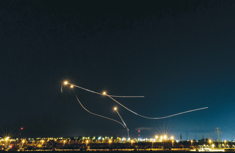  THE IRON Dome air defense system intercepts rockets fired from the Gaza Strip toward Israel, as seen from Sderot, last August. (photo credit: YONATAN SINDEL/FLASH90)
