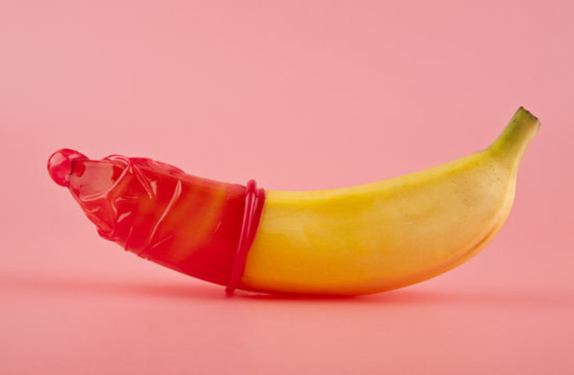  Banana sitting comfortably in a condom. (photo credit: CREATIVE COMMONS)