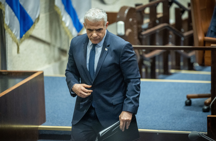  Opposition leader Yair Lapid seen during a plenum session in the assembly hall of the Knesset, in Jerusalem, on February 15, 2023.  (photo credit: YONATAN SINDEL/FLASH90)