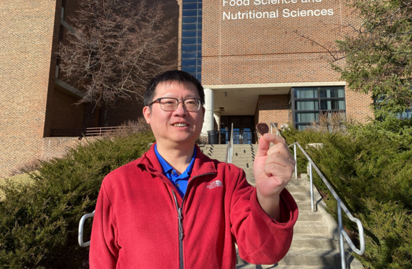  Professor with a heart: Rutgers Food Science Professor Qingrong Huang has produced low-fat chocolate hearts using a 3D printer. (credit: Christa Principato/Rutgers University)