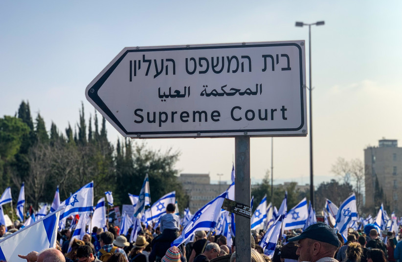  Israelis are seen demonstrating near the Supreme Court in Jerusalem ahead of a vote in the Knesset on judicial reform, on February 20, 2023. (credit: NOEMI SZAKACS)