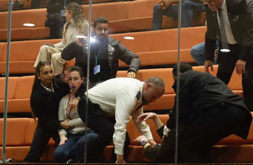  Protesters are seen being removed from the Israeli Knesset ahead of a planned vote on judicial reform, in Jerusalem, on February 20, 2023. (photo credit: MARC ISRAEL SELLEM/THE JERUSALEM POST)