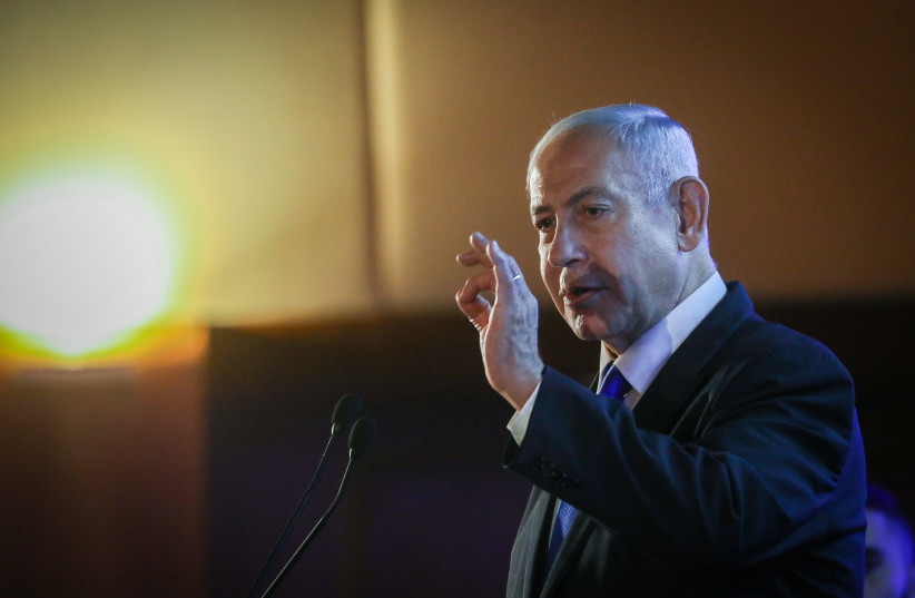  Israeli Prime Minister Benjamin Netanyahu speaks at the Conference of Presidents of Major American Jewish Organizations in Jerusalem, on February 19, 2023.  (credit: NOAM REVKIN FENTON/FLASH90)