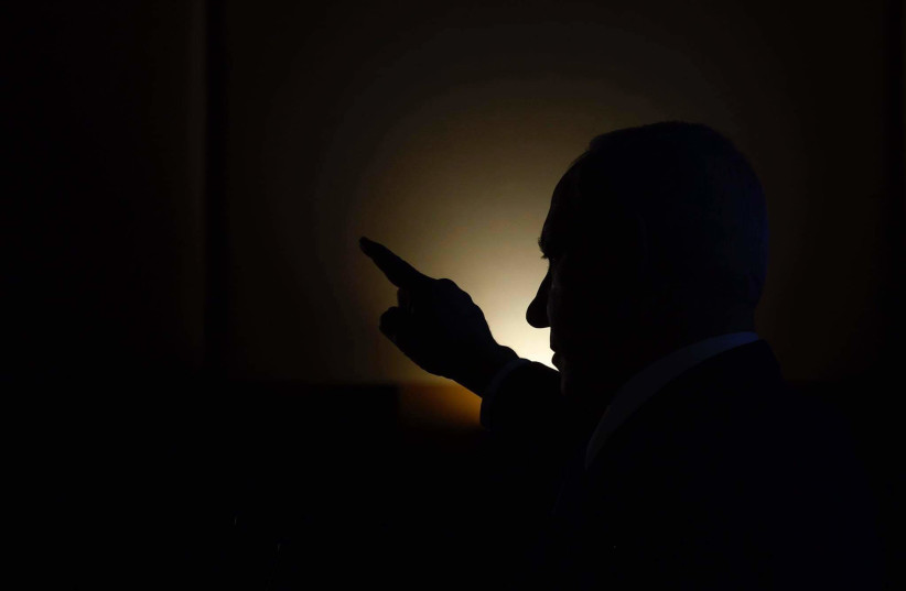  A silhouetted Israeli Prime Minister Benjamin Netanyahu. (credit: MARC ISRAEL SELLEM/THE JERUSALEM POST)
