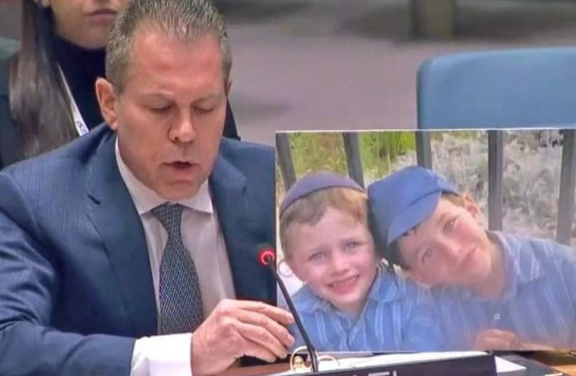  During Speech at UN Security Council, Israel's Ambassador Erdan, holds picture of murdered Israeli children (photo credit: ISRAEL'S MISSION TO THE UN)