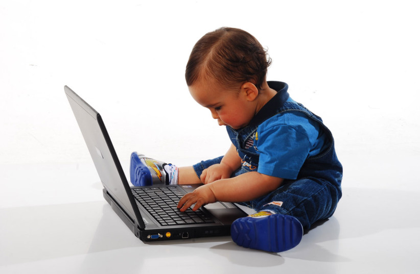 Toddler using a laptop (illustrative) (credit: PUBLICDOMAINPICTURES.NET)
