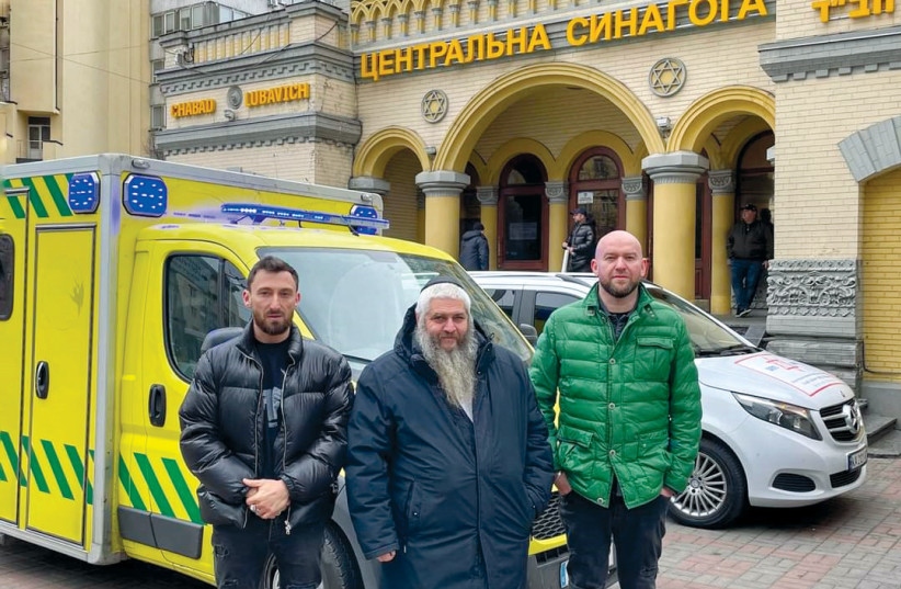  Azman and his assistants outside Chabad headquarters in Kyiv. Much of his work has been based here. (credit: Office of Chief Rabbi of Ukraine)
