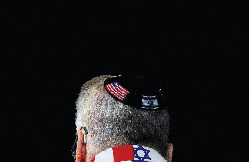  A member of the audience wears a United States-Israel themed custom suit during an AIPAC convention in Washington.  (photo credit: TOM BRENNER/REUTERS)