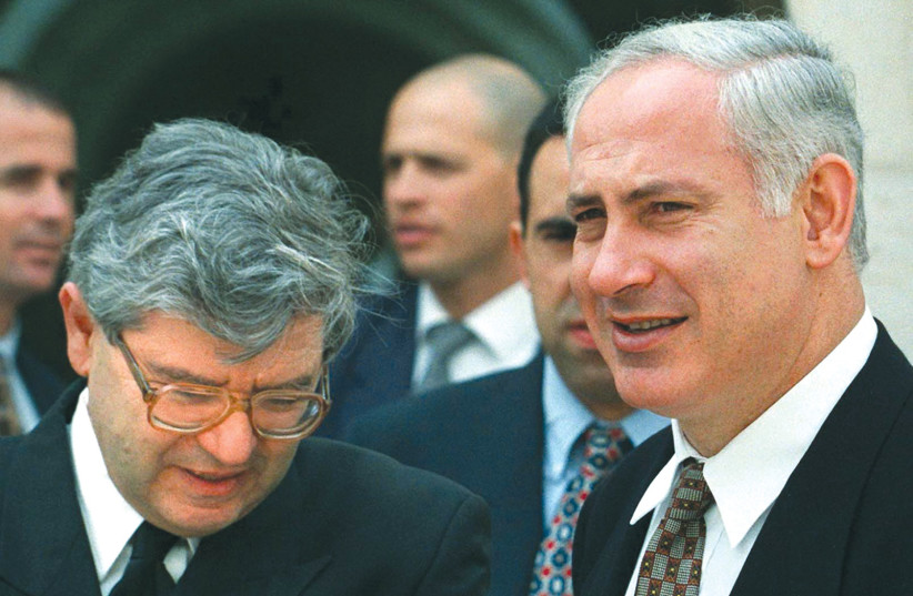  Prime Minister Benjamin Netanyahu and then-chief justice Aharon Barak during a tour of the Supreme Court in 1997. (credit: REUTERS)