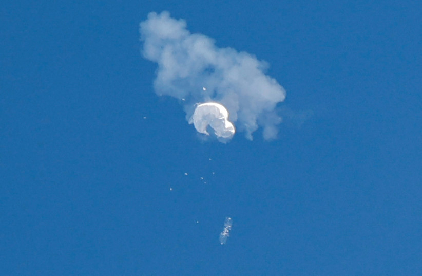  THE SUSPECTED Chinese spy balloon drifts toward the Atlantic Ocean after being shot down off the coast of South Carolina, earlier this month.  (photo credit: RANDALL HILL/REUTERS)