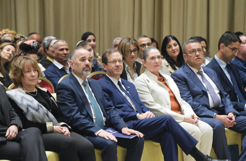  MICHAL HERZOG, flanked by President Isaac Herzog and Jerusalem Mayor Moshe Lion, watches a film about youth at risk. (photo credit: BRUNO SHARVIT)