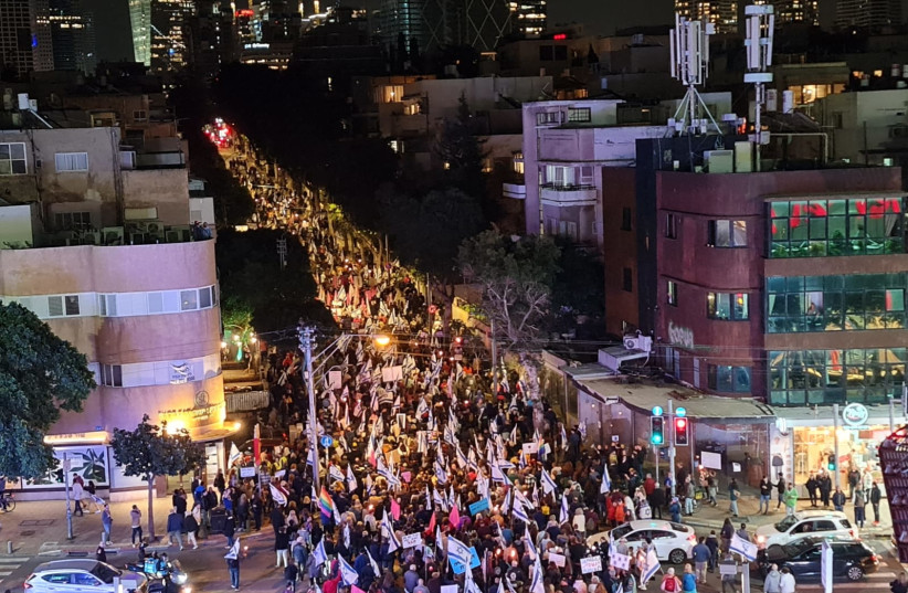  Israeli protestors begin marching from Haifa's Carmel neighborhood on Saturday, February 25, 2023 (photo credit: OMRI ROSENBERG)