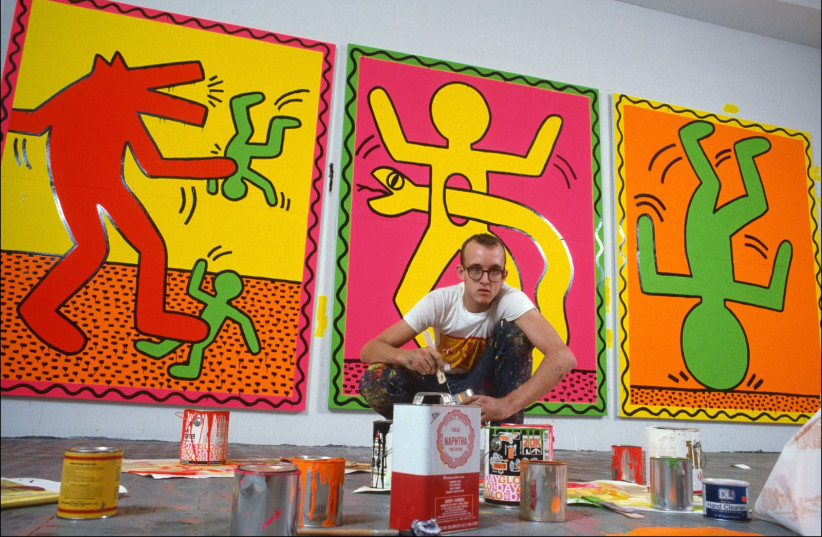  Artist Keith Haring at work in his studio making paintings for an upcoming art exhibit. (photo credit: Allan Tannenbaum)