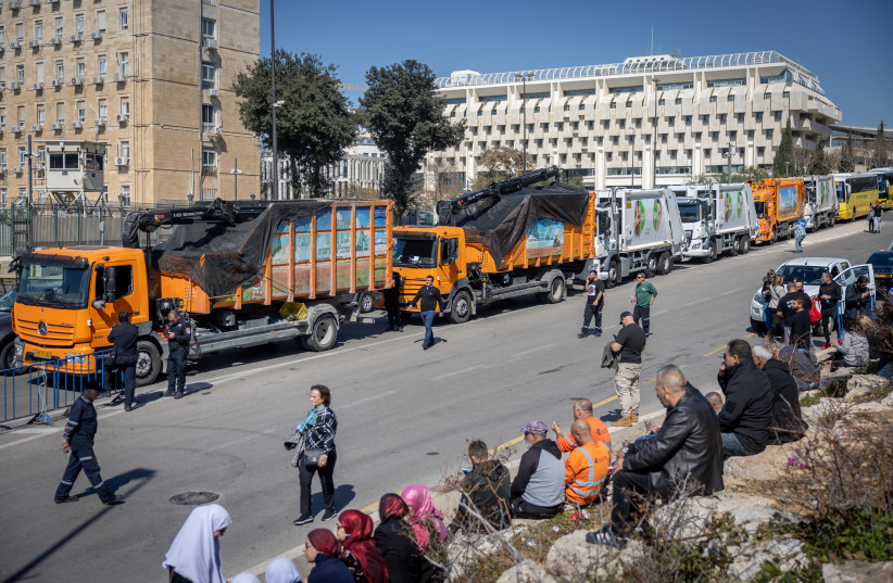 Garbage trucks block the road near the Prime Minister's Office in Jerusalem during a demonstration of the local authorities demanding better budgets, February 26, 2023.  (credit: YONATAN SINDEL/FLASH90)