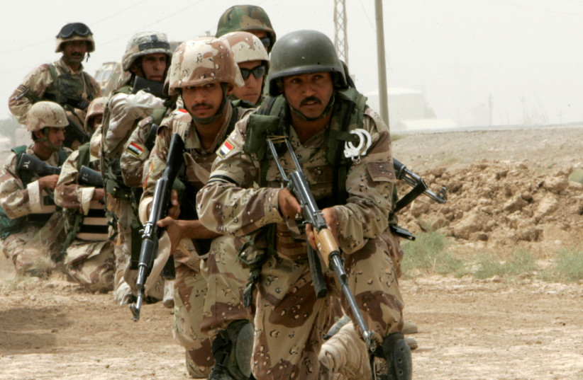 Iraqi soldiers conduct a search operation in the town of Khan Bani Saad, north of Baghdad, Iraq, August 1, 2008. (credit: REUTERS/THAIER AL-SUDANI/FILE PHOTO)