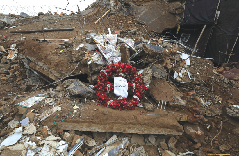  A WREATH laid on top of the debris of a mosque that was attacked by a suicide bomber in Peshawar, last month. Pakistani Taliban (TTP) claimed responsibility for the attack. (photo credit: Fayaz Aziz/Reuters)
