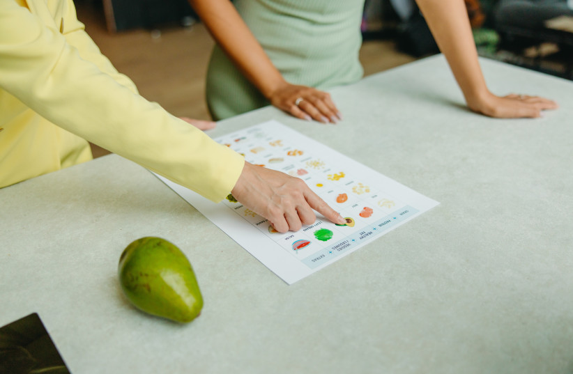  Illustrative image of a nutritionist showing a client their diet plan (credit: PEXELS)