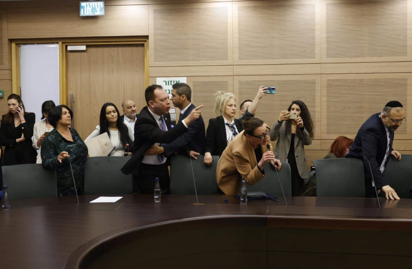  Opposition MKs are removed from the Constitution Law and Justice Committee judicial reform debate, March 1, 2023. (credit: MARC ISRAEL SELLEM/THE JERUSALEM POST)