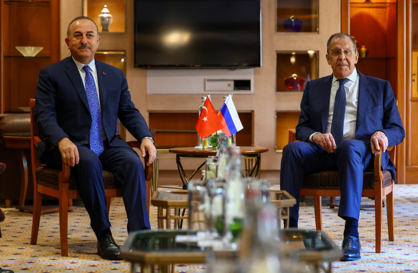  Russian Foreign Minister Sergei Lavrov meets with Turkish Foreign Minister Mevlut Cavusoglu on the sidelines of G20 foreign ministers' meeting in New Delhi, India, March 1, 2023. (photo credit: RUSSIAN FOREIGN MINISTRY/HANDOUT VIA REUTERS)