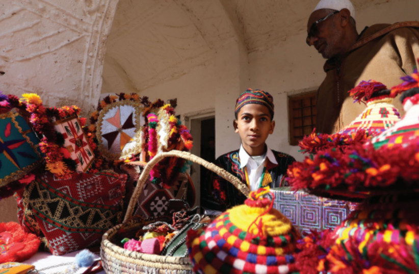 A YOUNG boy in colorful attire takes part in a festival opening in the Libyan town of Ghadames, Feb. 1 (credit: MAHMUD TURKIA/AFP VIA GETTY IMAGES)