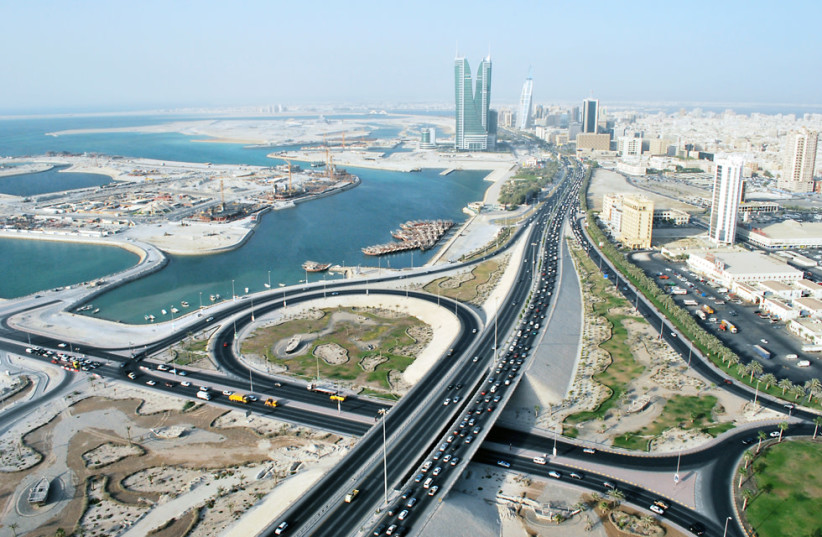 Skyline with roads, towers and harbor of Manama, Bahrain (photo credit: JAYSON DE LEON/CC BY 2.0 (https://creativecommons.org/licenses/by/2.0)/VIA WIKIMEDIA COMMONS)