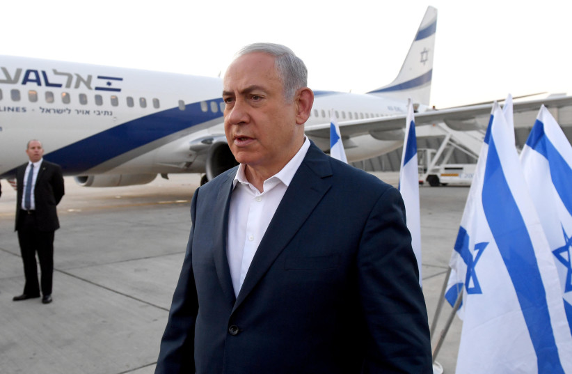  Prime Minister Benjamin Netanyahu departs on his flight to Kenya from the Ben Gurion Airport in Tel Aviv, on November 28, 2017 (credit: HAIM ZACH/GPO)