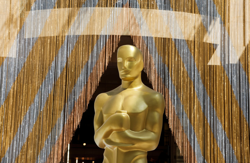  An Oscar statue is pictured as preparations for the Academy Awards are underway in Los Angeles, California, U.S., March 25, 2022. (photo credit: ERIC GAILLARD/REUTERS)