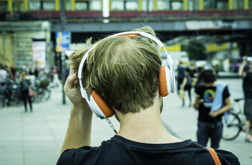  Illustrative image of a man with headphones. (credit: FLICKR)