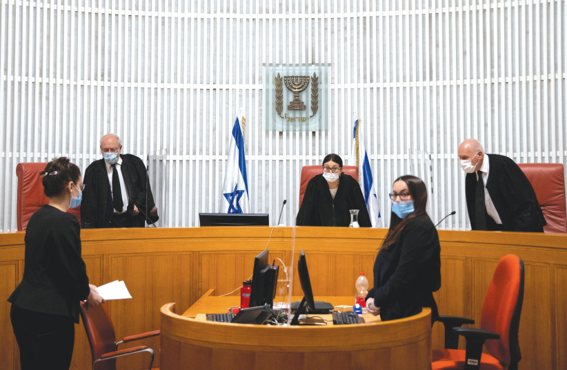  SUPREME COURT President Esther Hayut (center) and her fellow justices take their seats for a court hearing. (photo credit: YONATAN SINDEL/FLASH90)