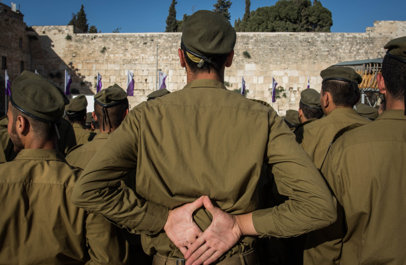 Israeli soldiers attend a swearing-in ceremony as they enter the Givati Brigade  unit, at the Western Wall in Jerusalem Old City, June 23, 2016. (photo credit: ZACK WAJSGRAS/FLASH90)
