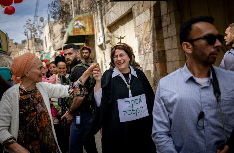  Israeli National Missions Minister Orit Struck is seen in Hebron dressed as Supreme Court Chief Justice Esther Hayut for the holiday of Purim, on March 7, 2023. (photo credit: YONATAN SINDEL/FLASH90)