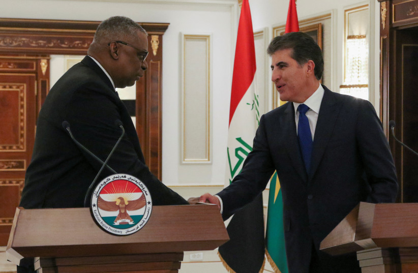  US Defense Secretary Lloyd Austin and President of the Kurdistan region in Iraq Nechirvan Barzani shake hands as they attend a joint news conference, in Erbil, Iraq March 7, 2023. (credit: AZAD LASHKARI/REUTERS)