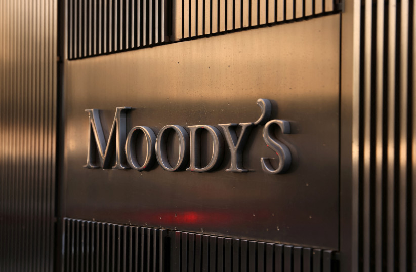 Signage is seen outside the Moody's Corporation headquarters in Manhattan, New York, US, November 12, 2021. (credit: REUTERS/ANDREW KELLY/FILE PHOTO)