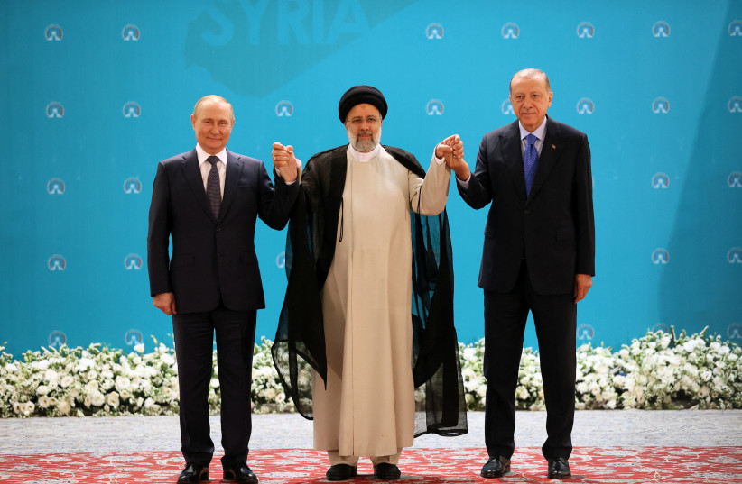  Russian President Vladimir Putin, Iranian President Ebrahim Raisi and Turkish President Tayyip Erdogan pose for a picture before a meeting of leaders from the three guarantor states of the Astana process, designed to find a peace settlement in Syria crisis, in Tehran, Iran July 19, 2022.  (credit: Sputnik/Sergei Savostyanov/Pool via REUTERS)