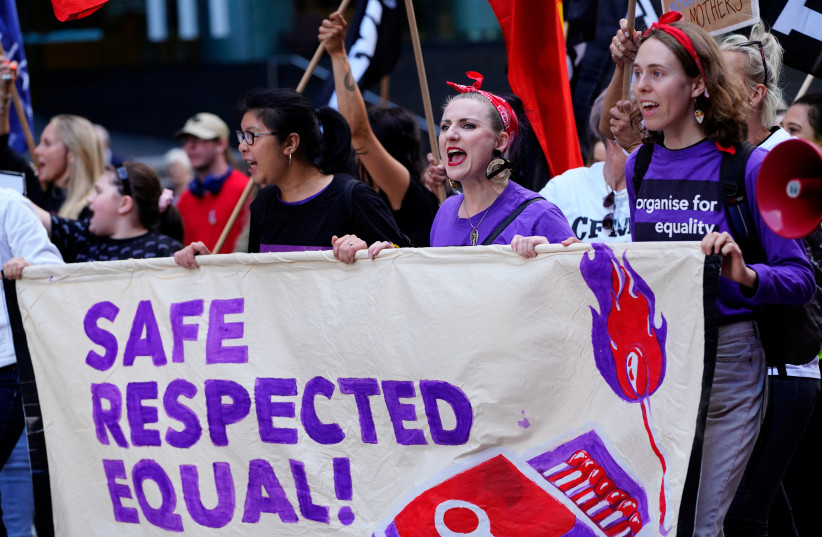  People participate in an International Women's Day demonstration, in Melbourne, Australia, March 8, 2023. (photo credit: REUTERS/SANDRA SANDERS)