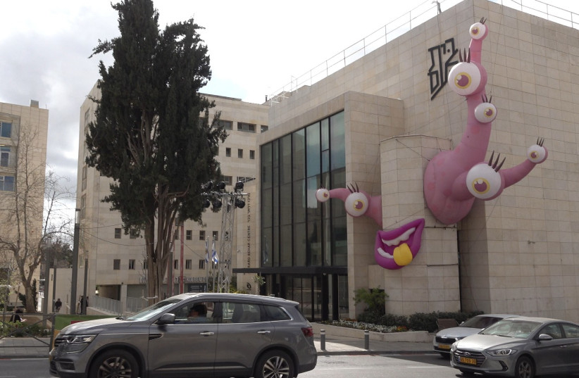 A monster designed by artist Adi Anna Telezhynski adorns the Beit Ha’am building in Jerusalem for Purim, March 6, 2023. (credit: GIL MEZUMAN/THE MEDIA LINE)