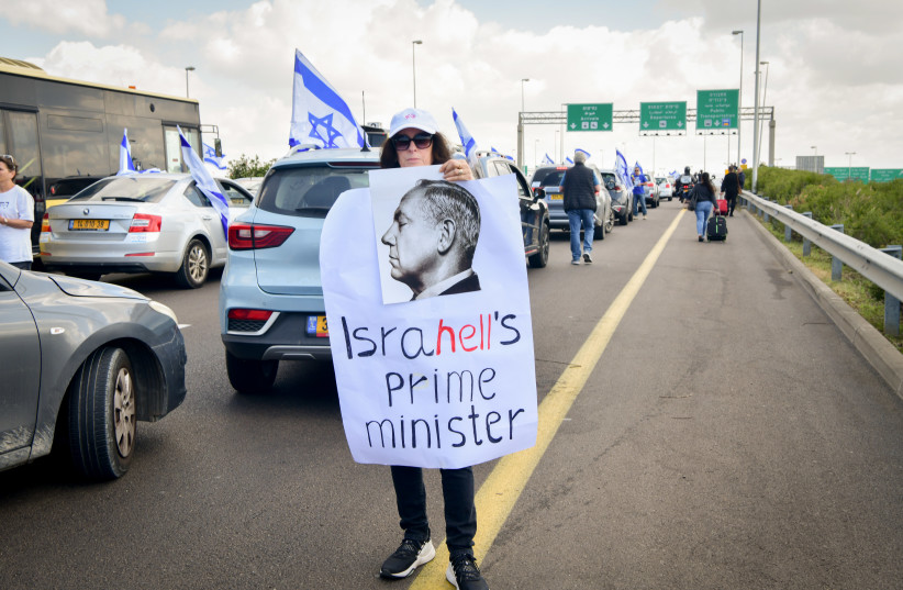 Travelers on their way to the Ben Gurion International Airport, where flights are being delayed due to protesters blocking the road to the airport, March 9, 2023.  (credit: AVSHALOM SASSONI/FLASH90)