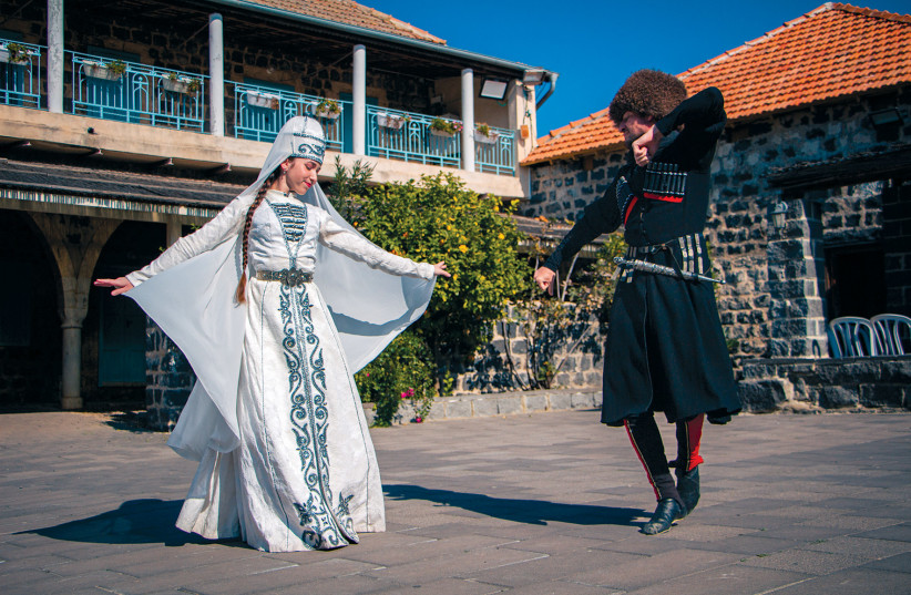  A young woman and man perform a traditional Circassian dance in Kfar Kama. (credit: LIAM FORBERG)