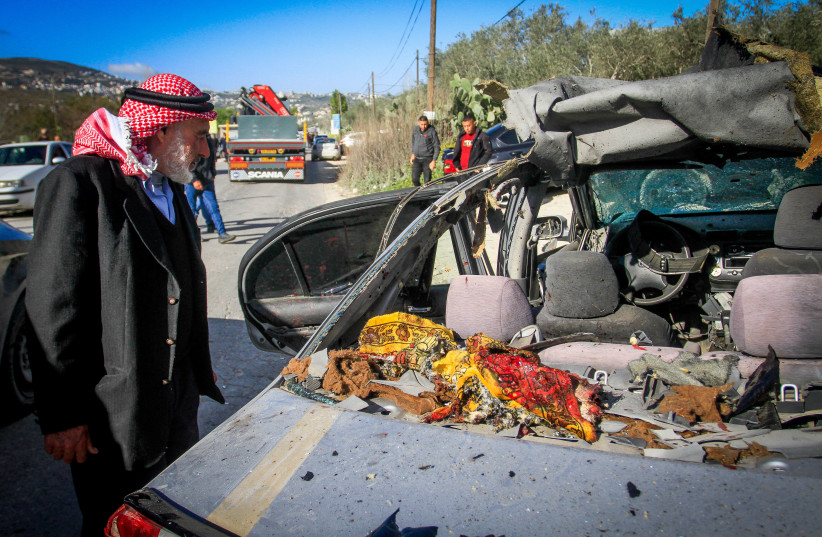  Palestinians inspect the car in which three Palestinians were killed by Israeli security forces in the village of Jaba near the West Bank city of Jenin, March 9, 2023.  (photo credit: NASSER ISHTAYEH/FLASH90)
