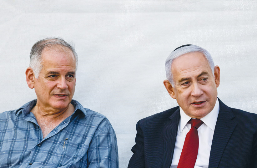  THE WRITER and Prime Minister Benjamin Netanyahu attend a memorial ceremony for their brother Yoni, in Jerusalem in 2021.  (photo credit: OLIVIER FITOUSSI/FLASH90)