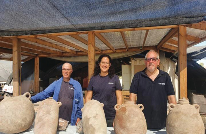  JON SELIGMAN (R) with fellow archaeologists Liat Nadav Ziv and Elie Haddad, with some of their finds at Yavne. (credit: Assaf Peretz/Israel Antiquities Authority)
