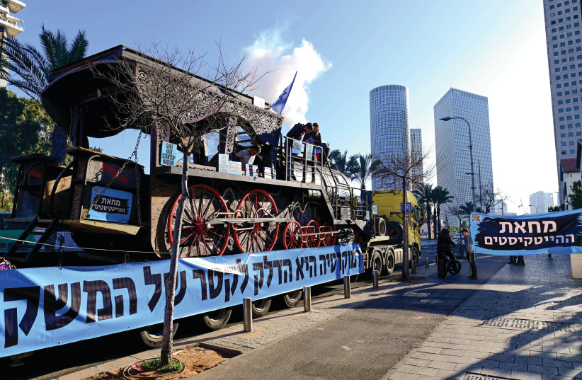  Workers from the hi-tech sector protest against the government’s planned judicial reform yesterday, in Tel Aviv. (photo credit: TOMER NEUBERG/FLASH90)