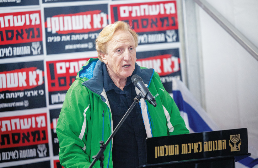  DR. ELIAD SHRAGA, founder and chairman of the Movement for Quality Government in Israel, speaks at a press conference against the proposed changes to the legal system, outside the Supreme Court in Jerusalem, last month. (photo credit: YONATAN SINDEL/FLASH90)